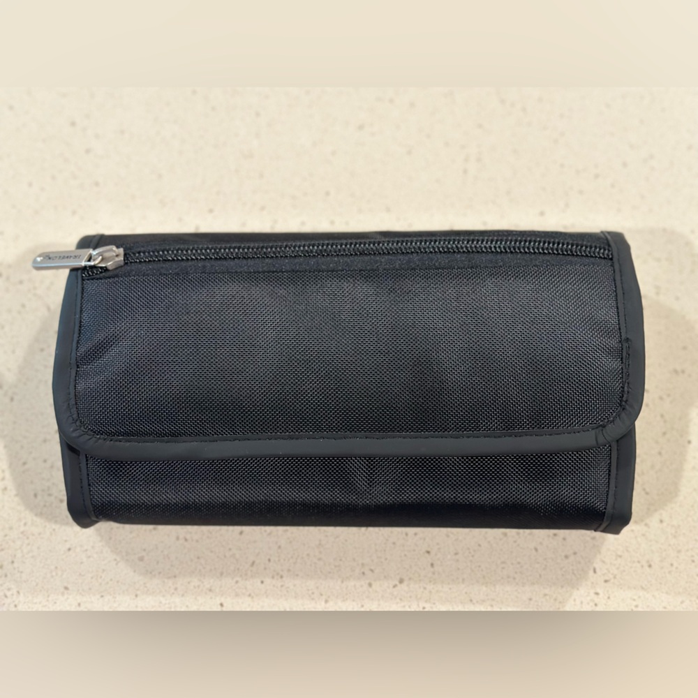 Black 7-day pill organizer with case. Only used once.